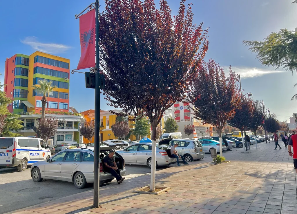 Tree-lined city street in Fier, Albania